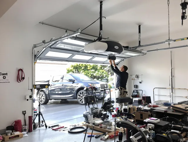 Corona Garage Door Repair specialist installing smart garage door opener system in Corona home