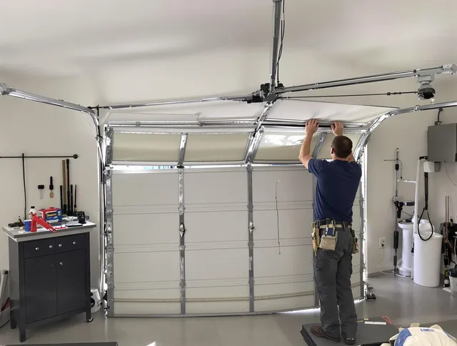 Corona Garage Door Repair specialist performing precise section replacement on Corona garage door