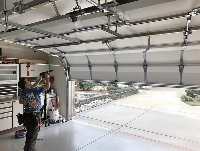 Garage door track repair service by Corona Garage Door Repair in Corona